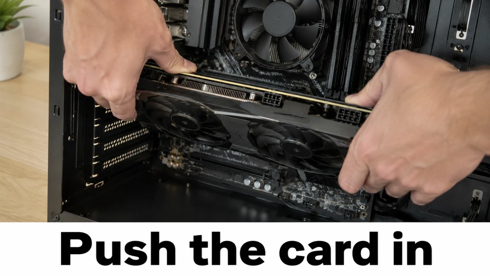 Hands reseating a graphics card and DIMM modules with power unplugged