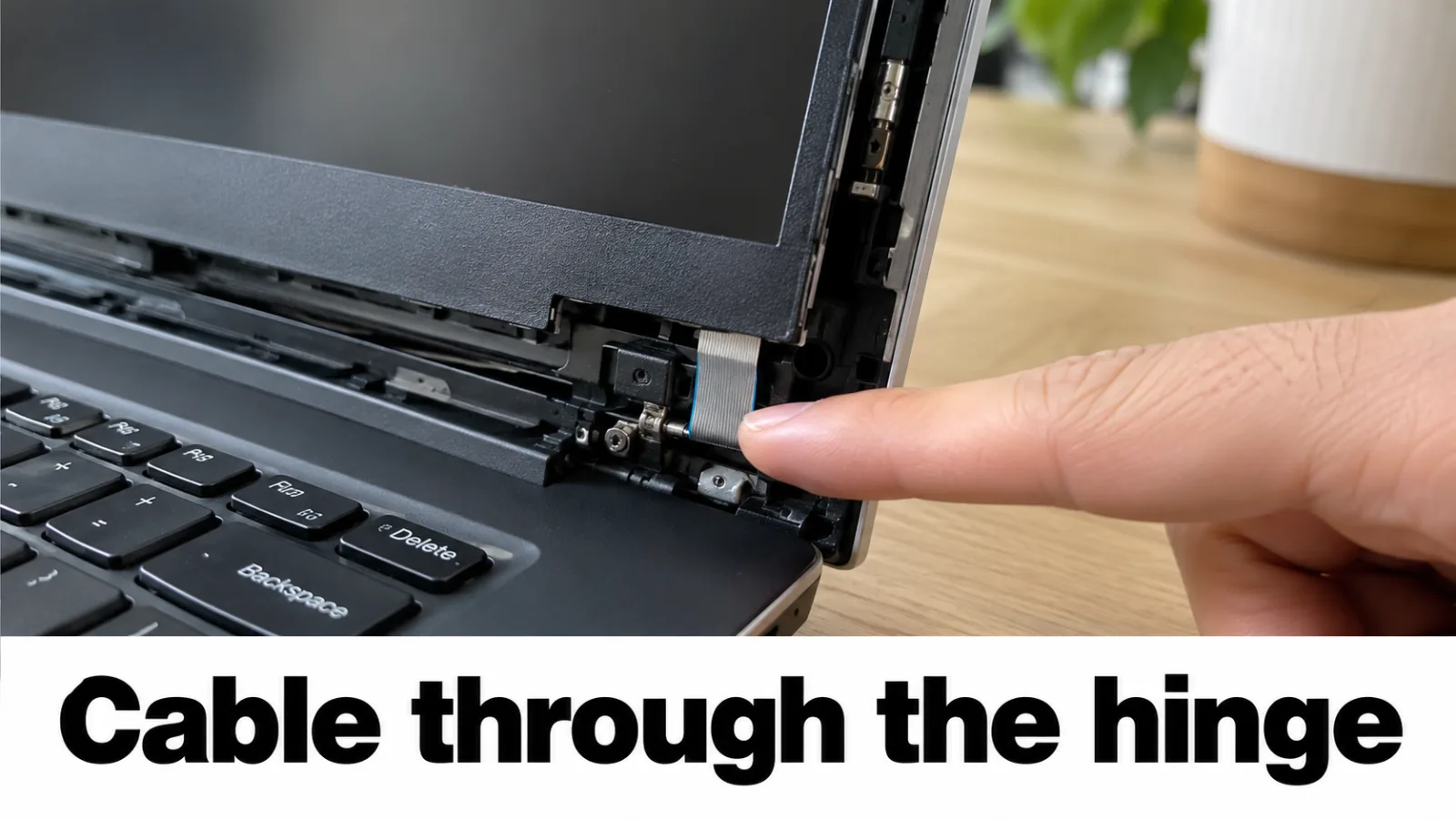 Service manual diagram highlighting the display cable route through the hinge